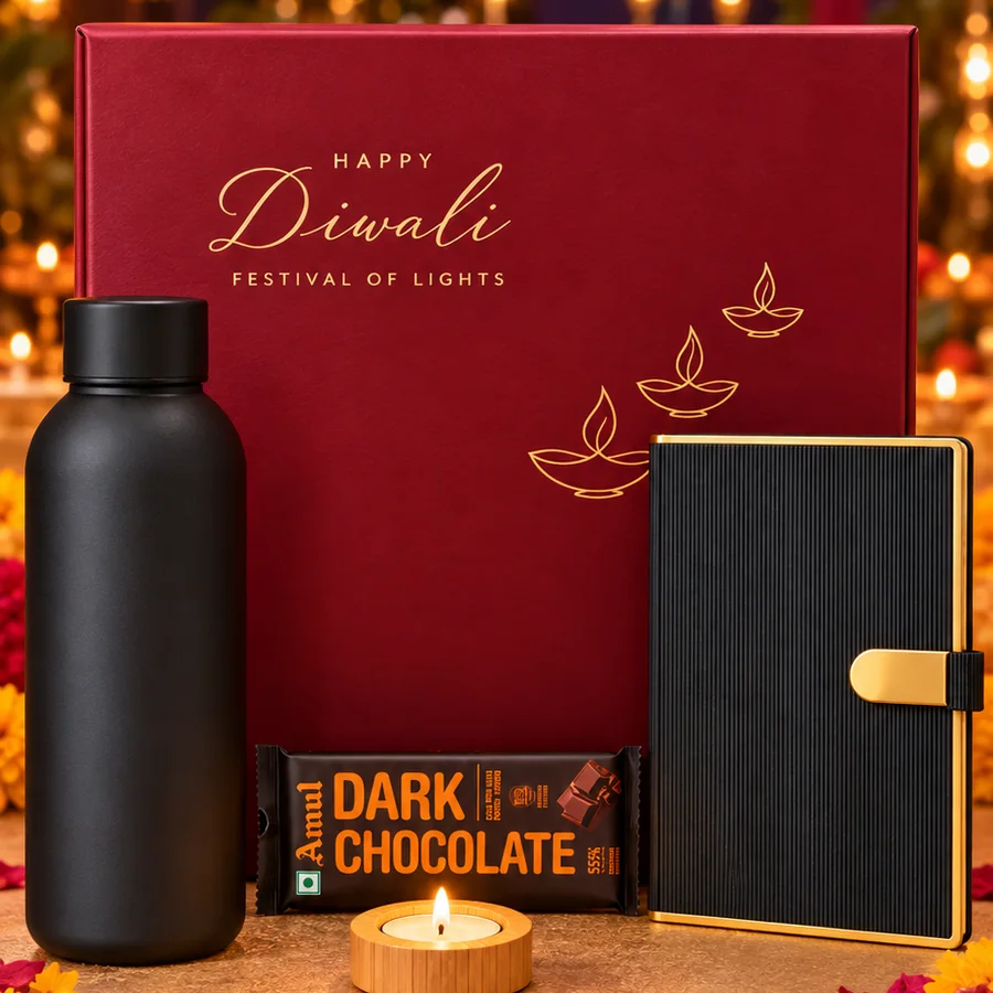 The Executive Diwali hamper: maroon gift box with black bottle, diary, dark chocolate and tealight