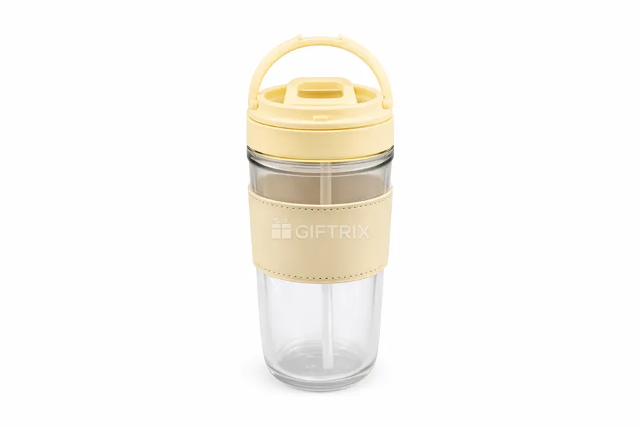Glass travel cup with beige leather sleeve and loop handle